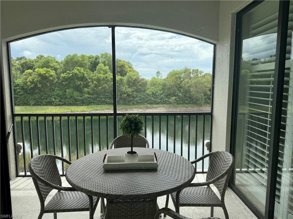 9498 Napoli Lane, Unit 201 Naples, FL 34113 - Photo 17 of 48 a view of a balcony and chairs