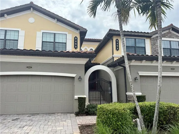 front view of a house with a potted plant