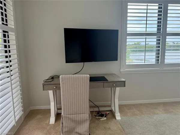 a workspace with furniture and a window