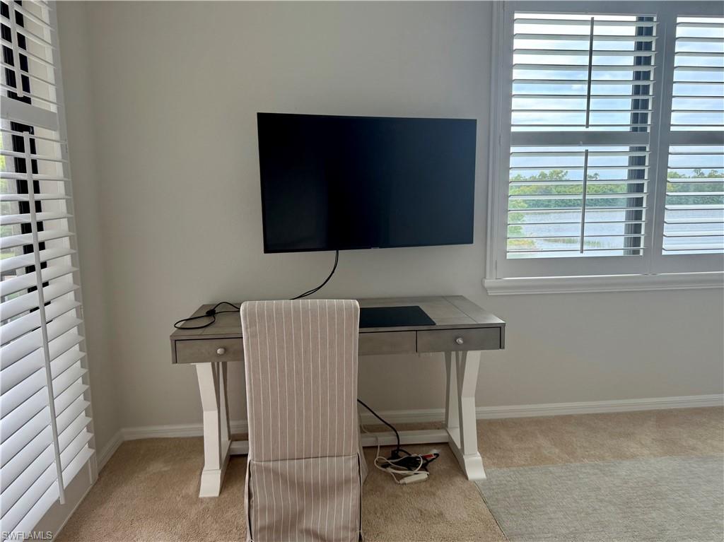 9498 Napoli Lane, Unit 201 Naples, FL 34113 - Photo 26 of 48 a workspace with furniture and a window