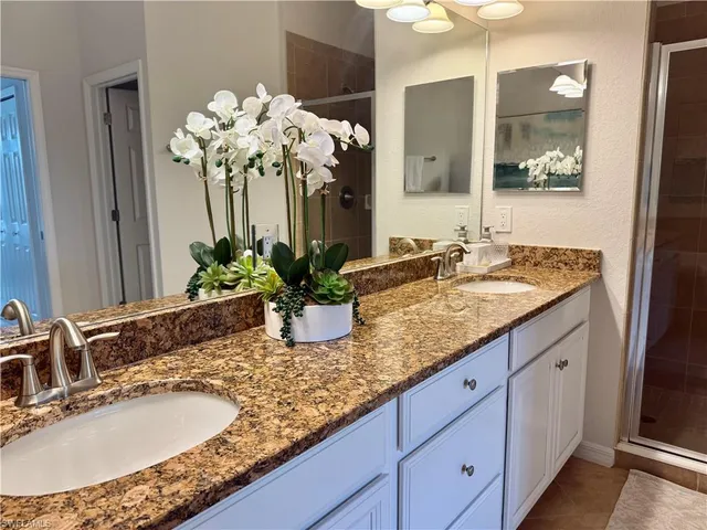 a bathroom with sink and mirror
