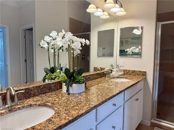 a bathroom with a sink a vanity and mirror