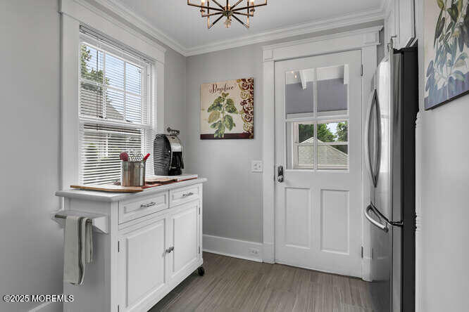 137 East Bergen Place Red Bank, NJ 07701 - Photo 12 of 40 a kitchen with white cabinets and window