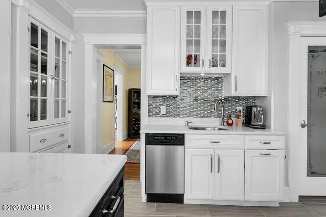 137 East Bergen Place Red Bank, NJ 07701 - Photo 15 of 40 a kitchen with stainless steel appliances granite countertop a stove and white cabinets