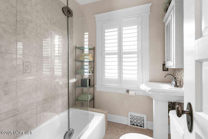 137 East Bergen Place Red Bank, NJ 07701 - Photo 22 of 40 a bathroom with a sink and a bathtub