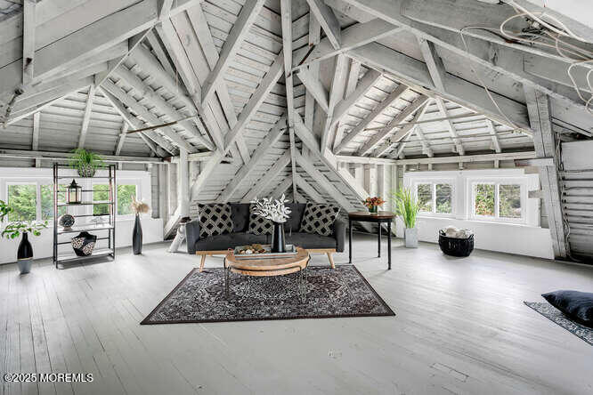 137 East Bergen Place Red Bank, NJ 07701 - Photo 24 of 40 a living room with lots of furniture and a chandelier