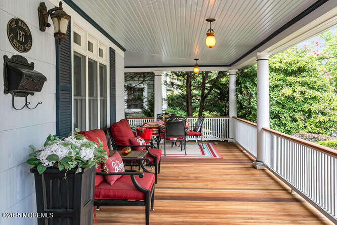 137 East Bergen Place Red Bank, NJ 07701 - Photo 33 of 40 a view of a porch with furniture and a potted plant
