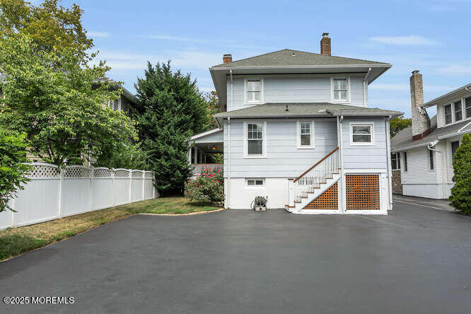 137 East Bergen Place Red Bank, NJ 07701 - Photo 36 of 40 a front view of a house with a yard