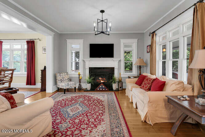 137 East Bergen Place Red Bank, NJ 07701 - Photo 5 of 40 a living room with furniture fireplace and flat screen tv