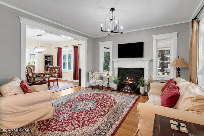 137 East Bergen Place Red Bank, NJ 07701 - Photo 6 of 40 a living room with furniture and a fireplace