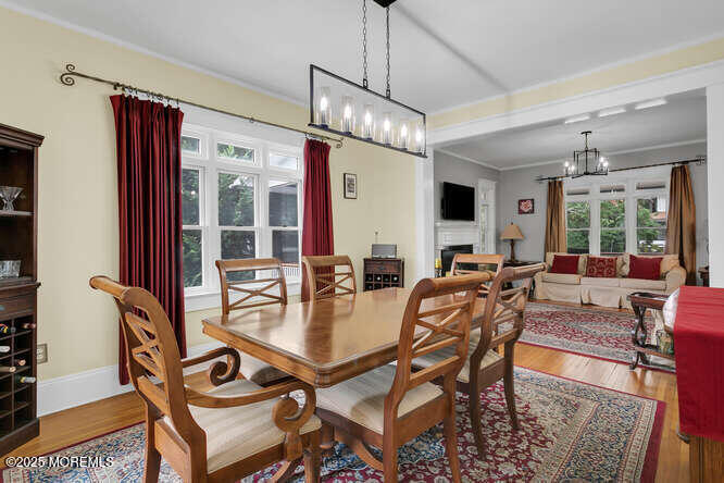 137 East Bergen Place Red Bank, NJ 07701 - Photo 8 of 40 a dining room with furniture a chandelier and wooden floor