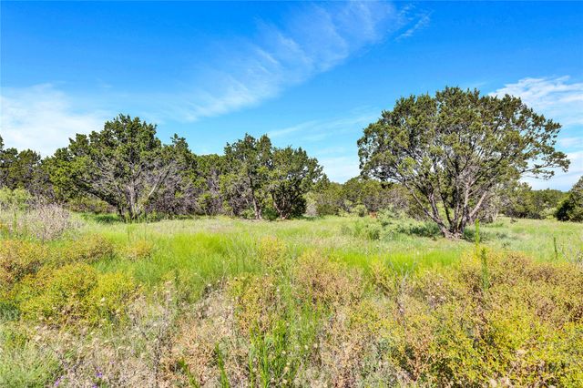 a view of a yard with an outdoor space and seating