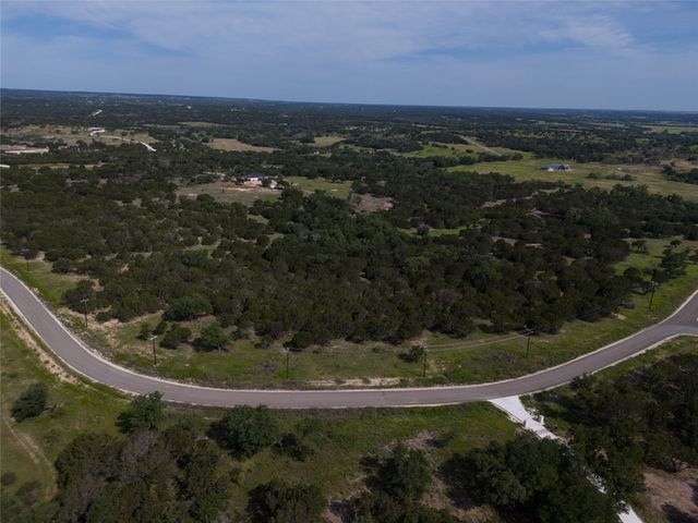 a view of a water fountain and a yard