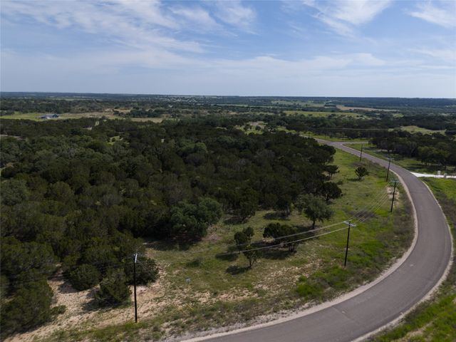 a view of a lake with a yard