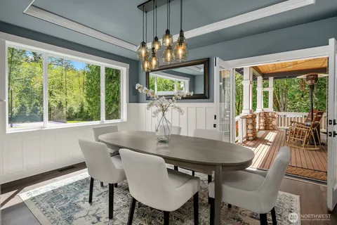 a view of a dining room with furniture window and outside view