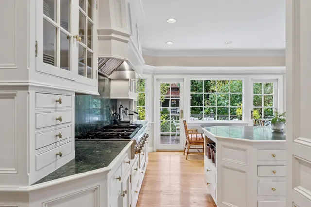 a dining room with furniture a rug and wooden floor