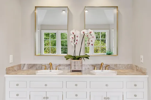 a bedroom with a bed and a book shelf