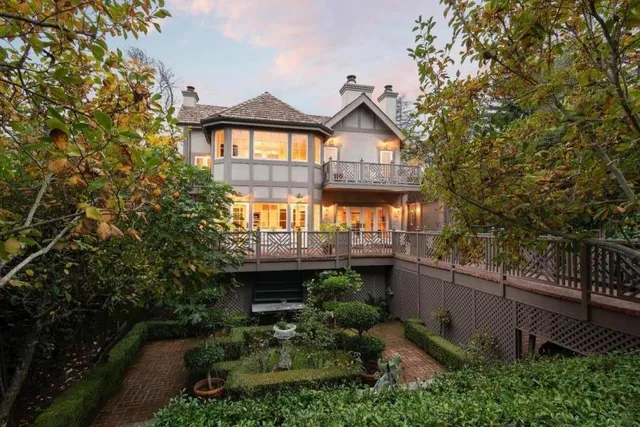 a front view of a house with garden