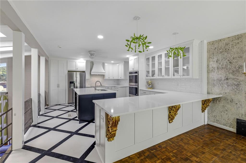 490 Maple Street Cornelia, GA 30531 - Photo 11 of 88 a large kitchen with stainless steel appliances granite countertop a stove a sink and a refrigerator