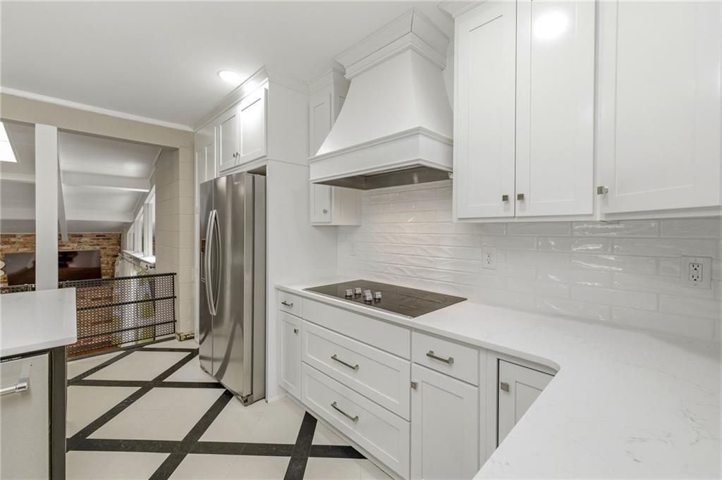 490 Maple Street Cornelia, GA 30531 - Photo 13 of 88 a kitchen with white cabinets and refrigerator