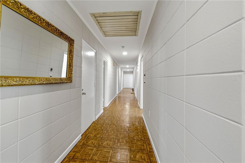 490 Maple Street Cornelia, GA 30531 - Photo 20 of 88 a view of a hallway with wooden floor