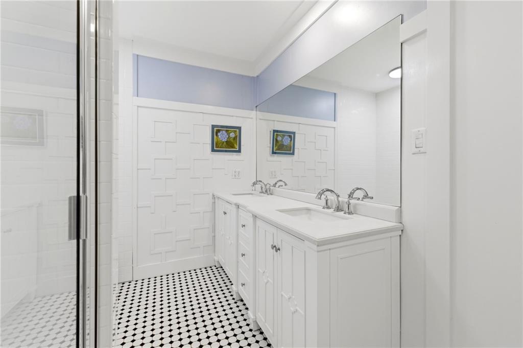 490 Maple Street Cornelia, GA 30531 - Photo 25 of 88 a bathroom with a sink a toilet and a mirror