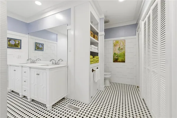 a bathroom with a toilet and a sink