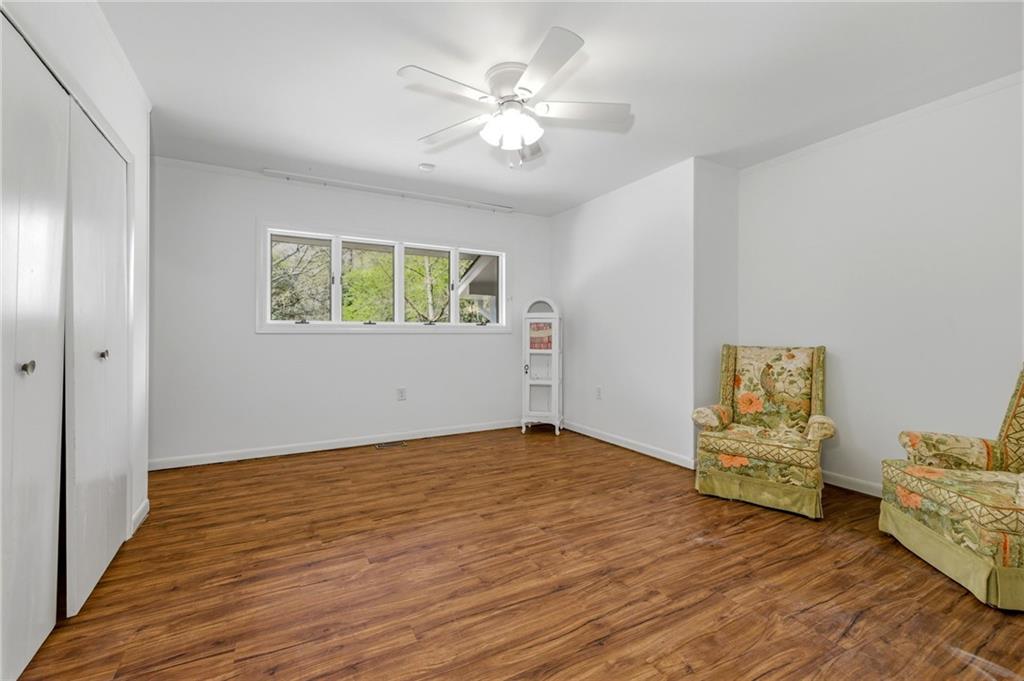490 Maple Street Cornelia, GA 30531 - Photo 29 of 88 an empty room with windows and ceiling fan