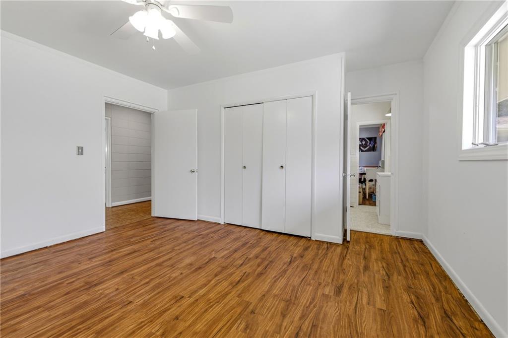 490 Maple Street Cornelia, GA 30531 - Photo 30 of 88 an empty room with wooden floor and windows