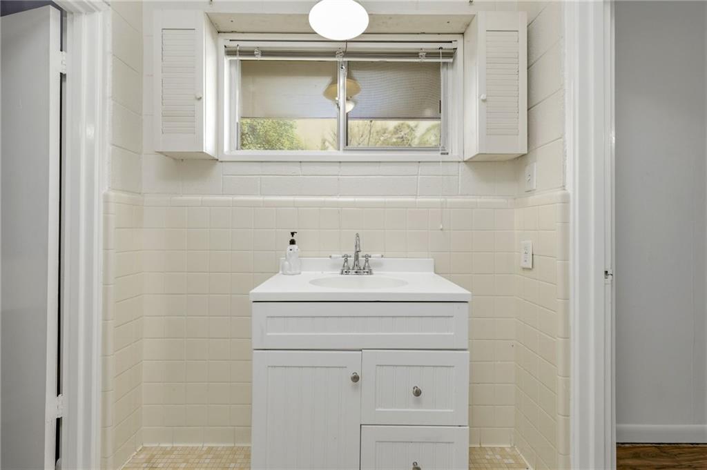 490 Maple Street Cornelia, GA 30531 - Photo 31 of 88 a bathroom with a sink and a mirror