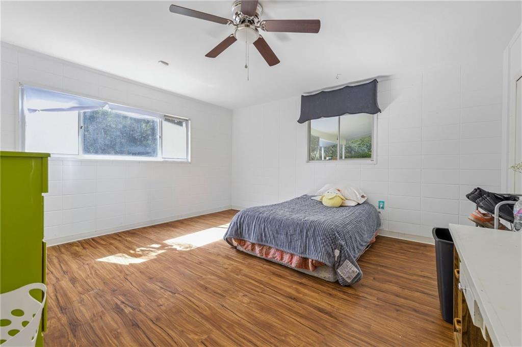 490 Maple Street Cornelia, GA 30531 - Photo 35 of 88 a living room with a bed furniture and a window
