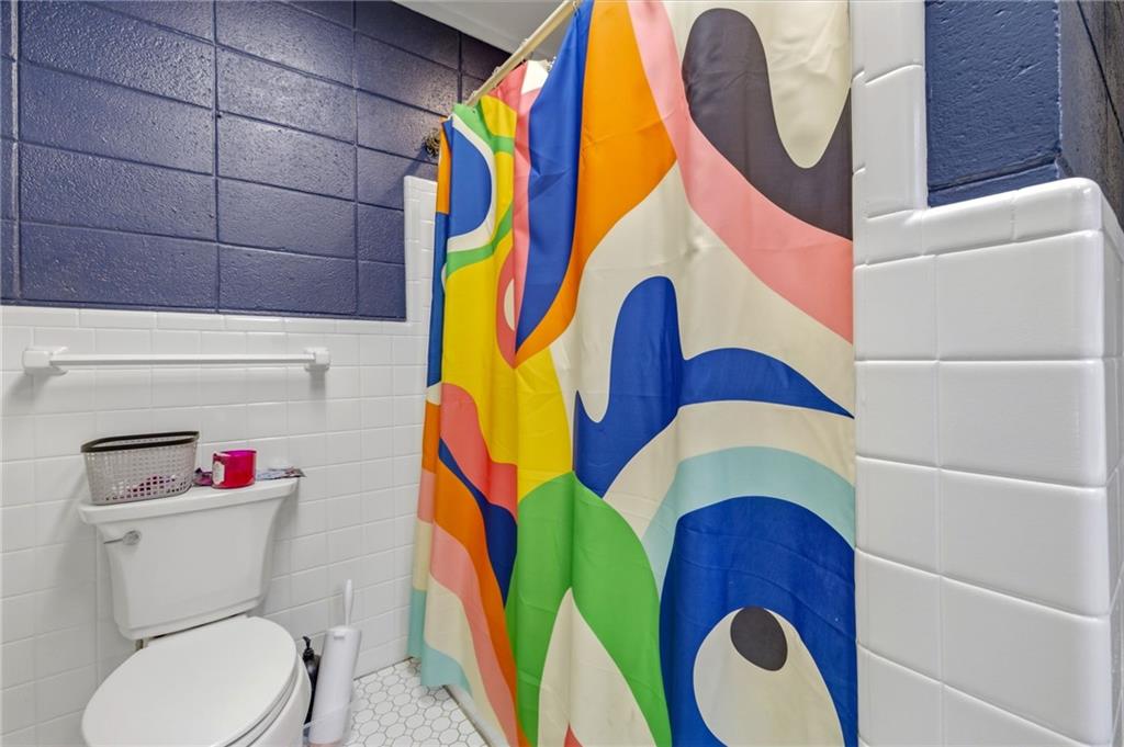 490 Maple Street Cornelia, GA 30531 - Photo 38 of 88 a bathroom with a toilet and a sink