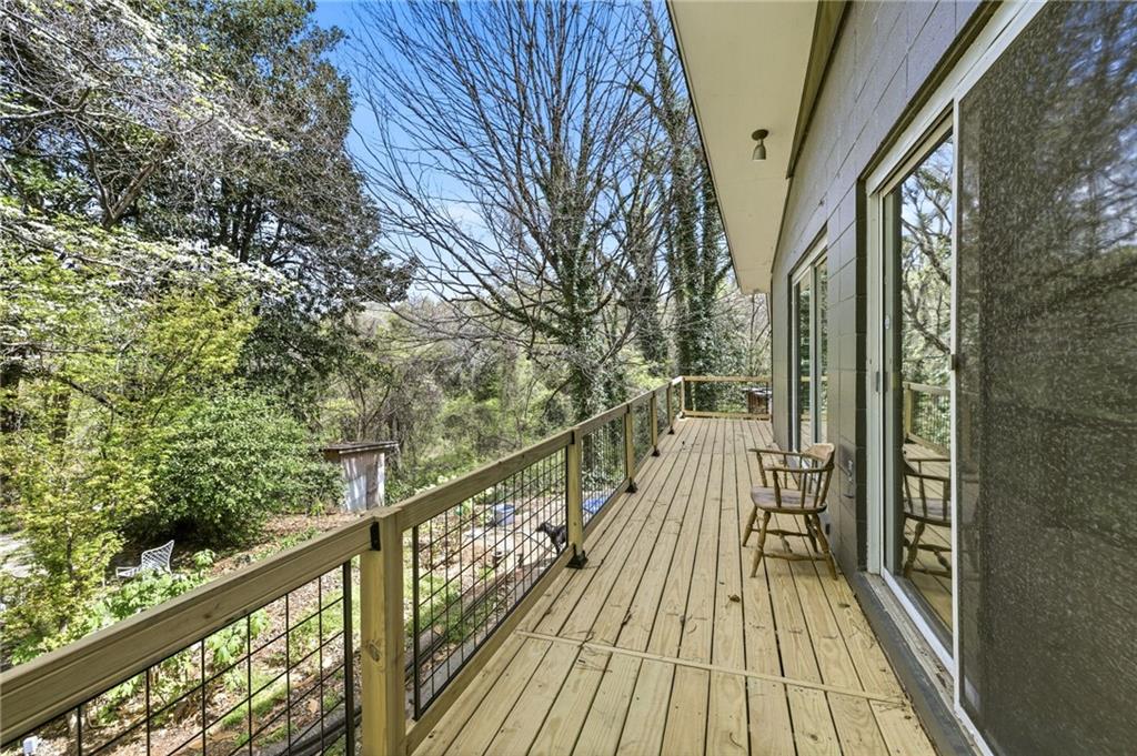 490 Maple Street Cornelia, GA 30531 - Photo 45 of 88 a view of balcony with wooden floor and fence