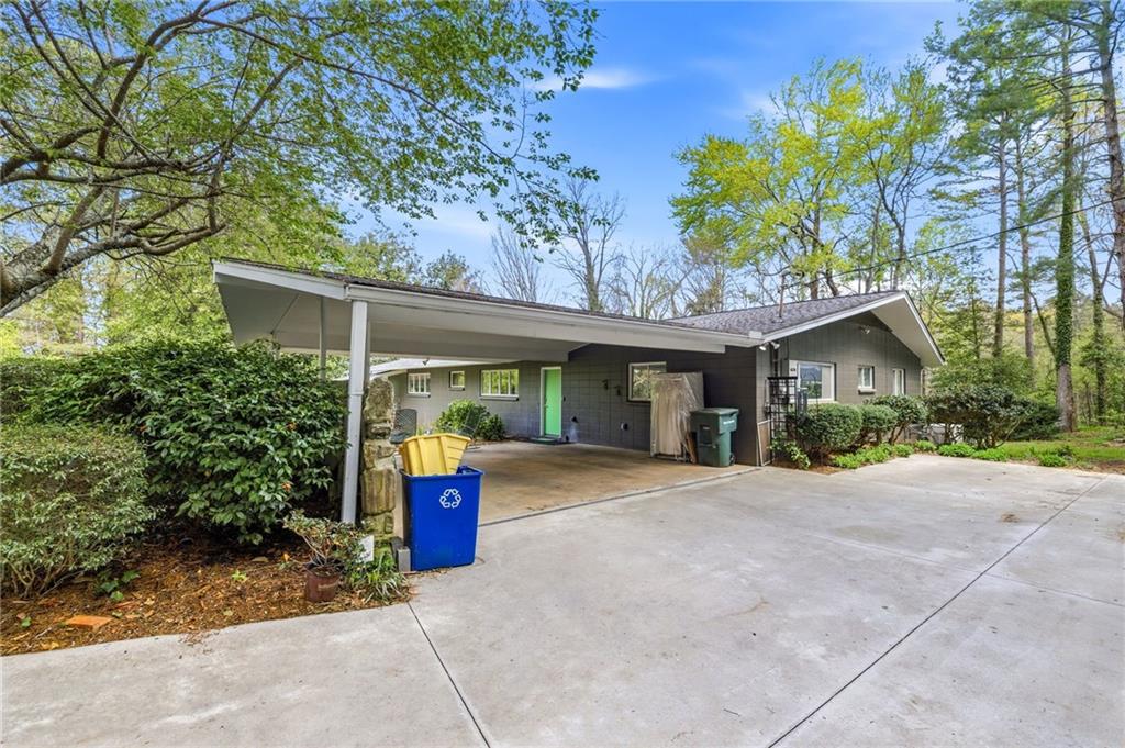 490 Maple Street Cornelia, GA 30531 - Photo 60 of 88 a view of a house with potted plants and large trees