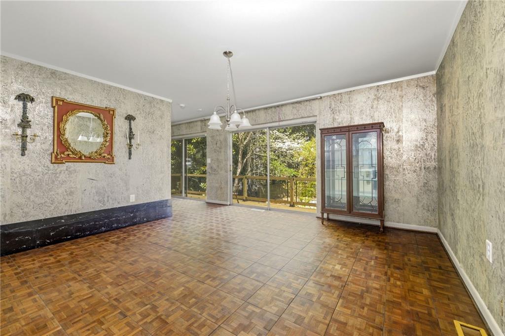 490 Maple Street Cornelia, GA 30531 - Photo 10 of 88 a view of an empty room with glass door and a window