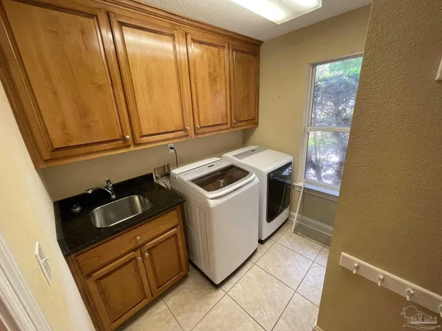 a bathroom with a sink a toilet a shower and mirror