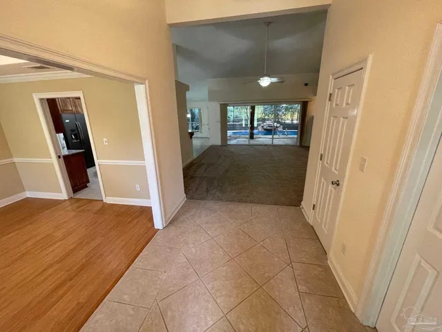 a view of hallway with window and stairs