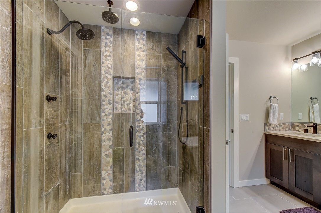 22827 23rd Avenue Southeast, Unit 7 Bothell, WA 98021 - Photo 13 of 19 a bathroom with a shower and a sink