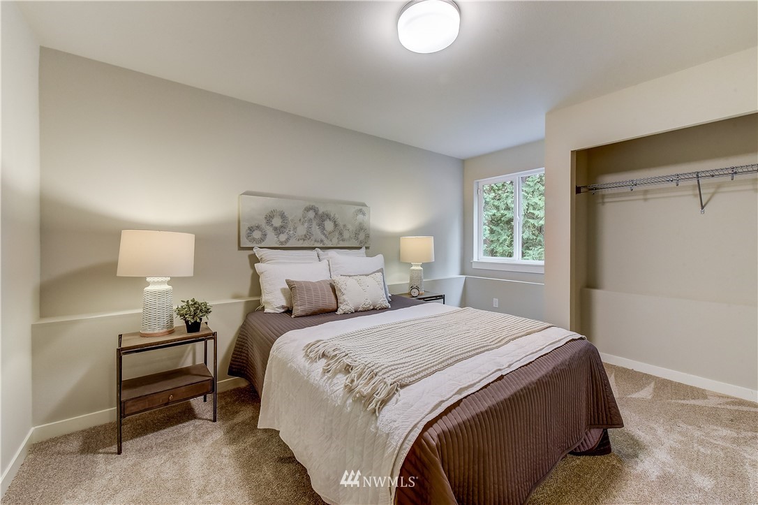 22827 23rd Avenue Southeast, Unit 7 Bothell, WA 98021 - Photo 17 of 19 a bedroom with a bed and a window