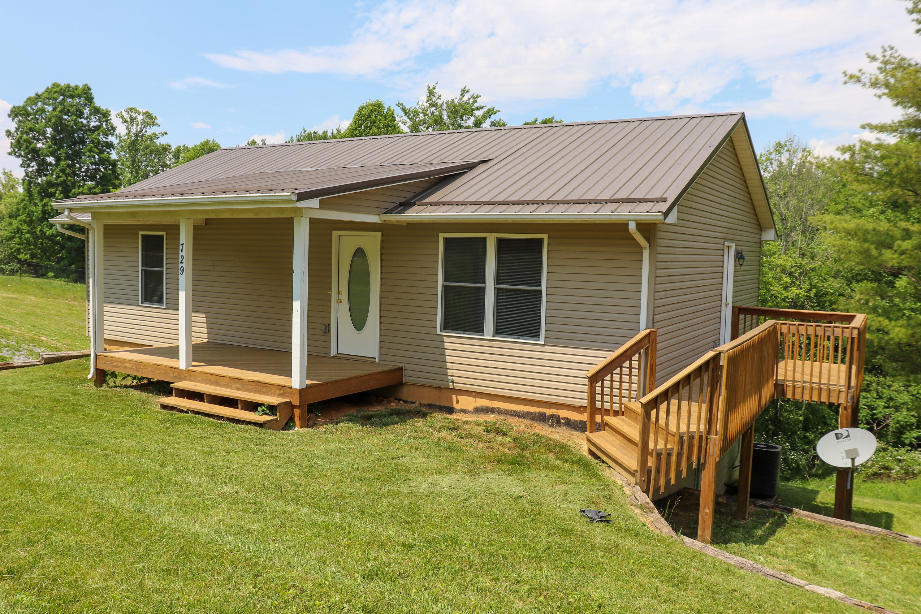 729 Huffville Road Northeast Pilot, VA 24138 - Photo 1 of 13 a view of a house with a yard