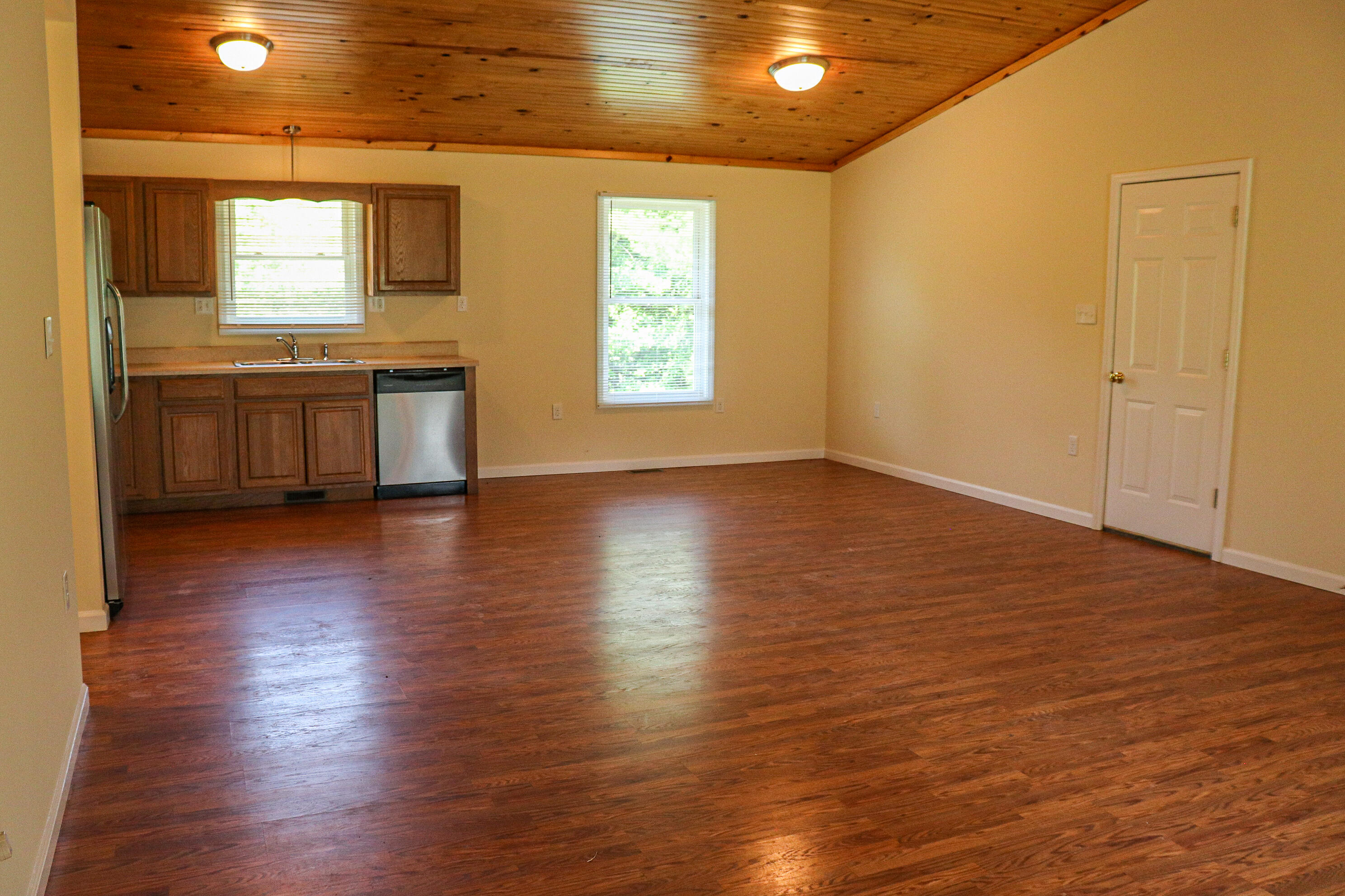 729 Huffville Road Northeast Pilot, VA 24138 - Photo 4 of 13 an empty room with wooden floor and windows