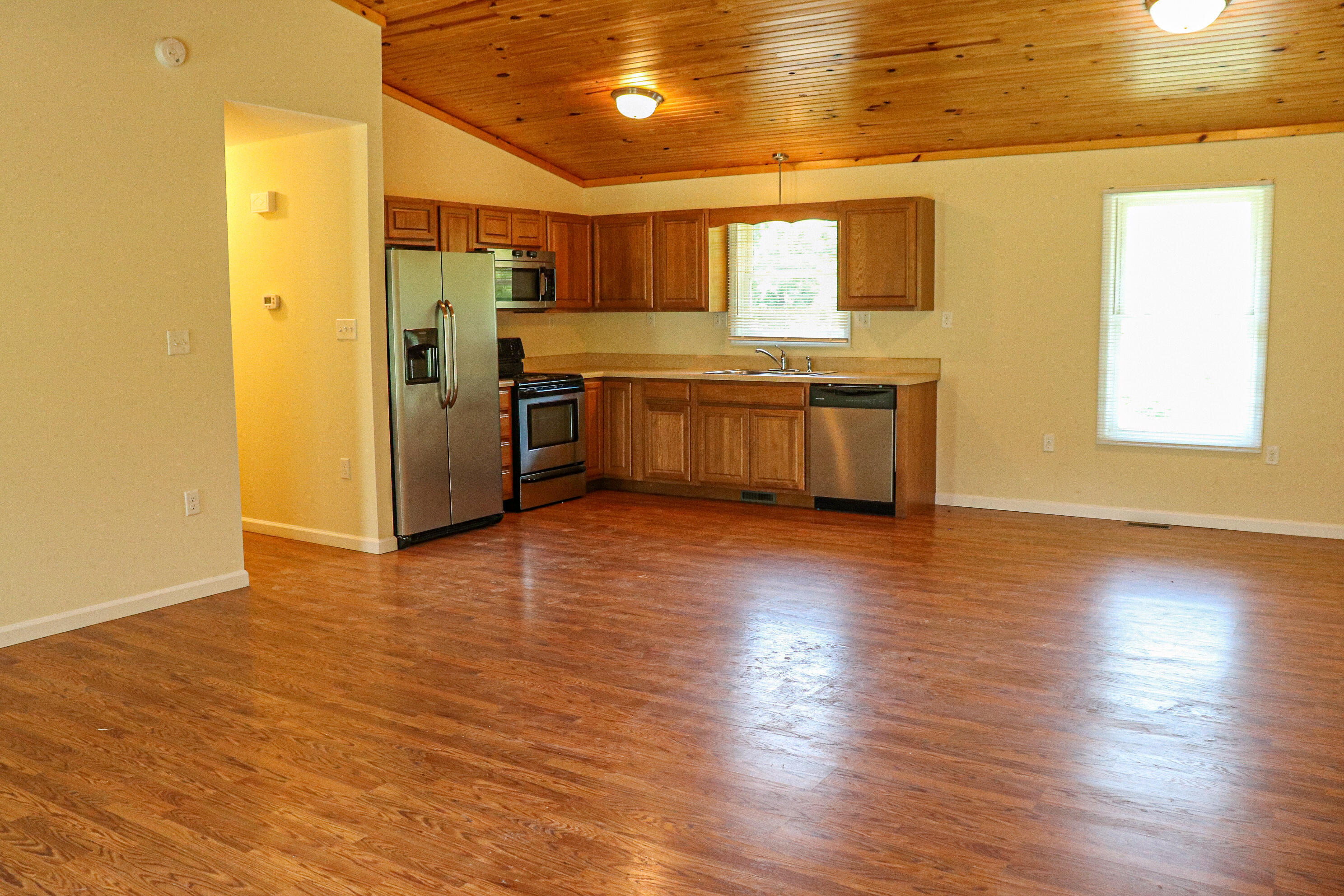 729 Huffville Road Northeast Pilot, VA 24138 - Photo 5 of 13 a kitchen with stainless steel appliances a refrigerator and a stove top oven