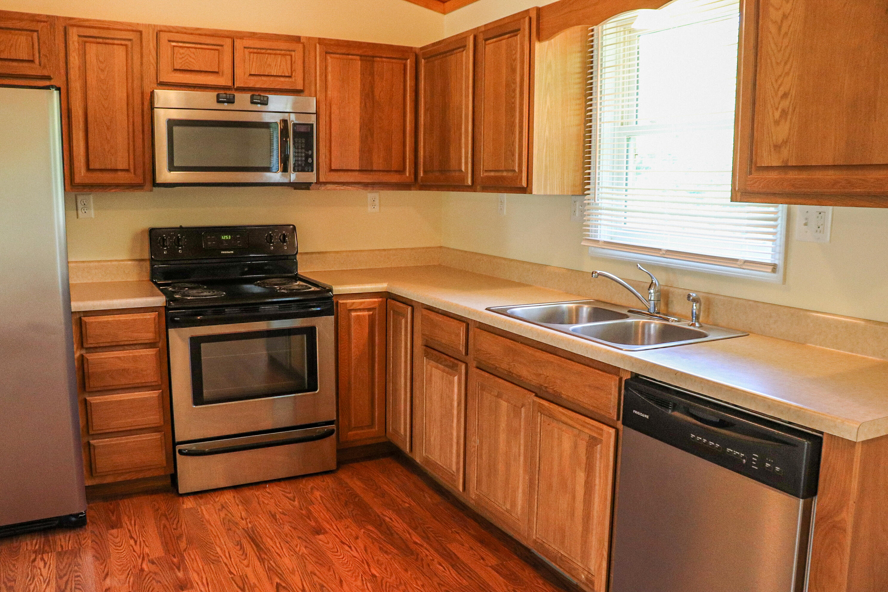 729 Huffville Road Northeast Pilot, VA 24138 - Photo 6 of 13 a kitchen with granite countertop cabinets stainless steel appliances and a window