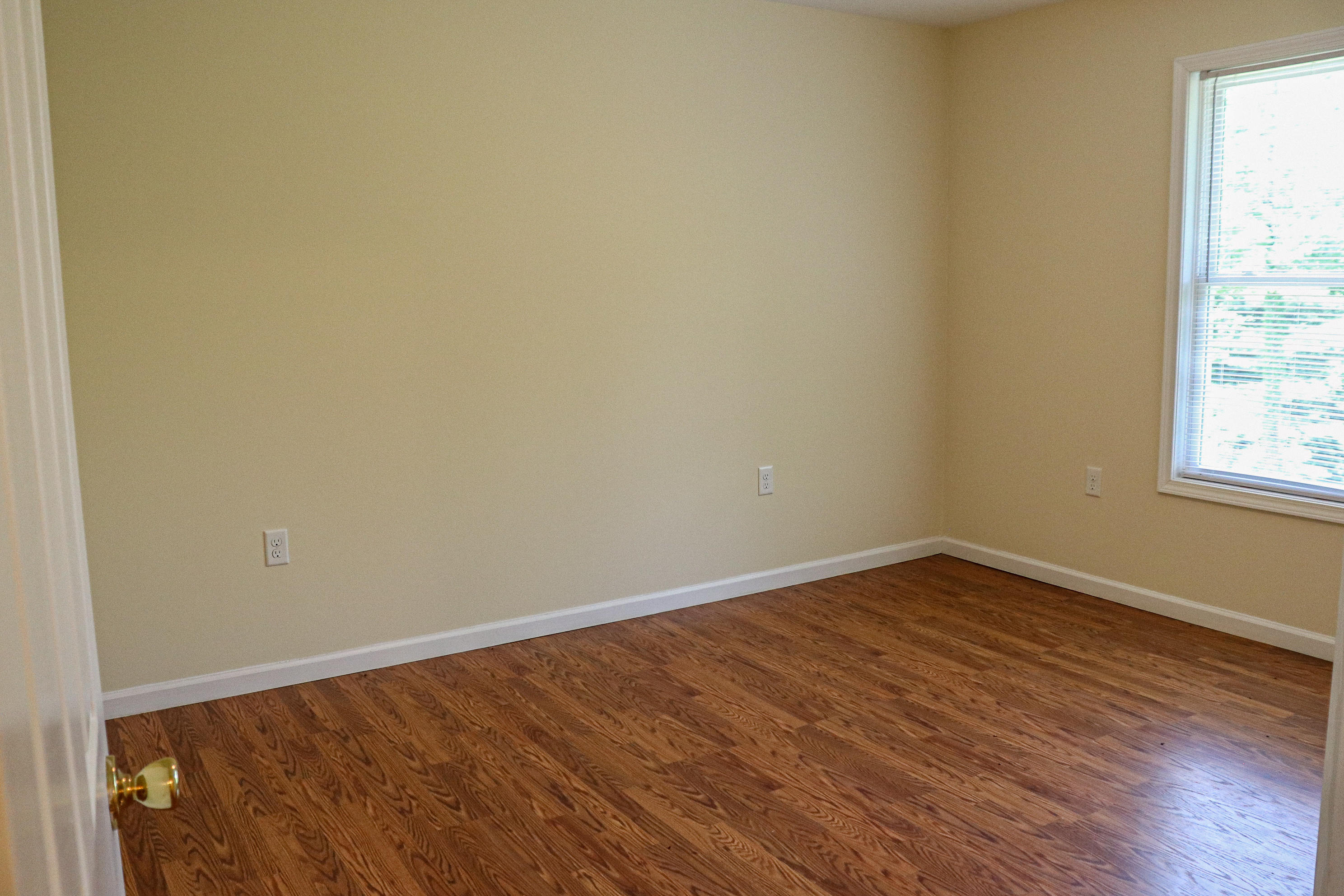 729 Huffville Road Northeast Pilot, VA 24138 - Photo 8 of 13 a view of an empty room with wooden floor and a window