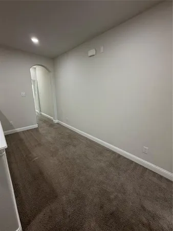 an empty room with a mirror