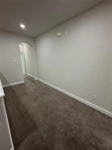 an empty room with a mirror