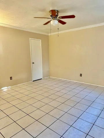 a view of a room with a mirror and a fan