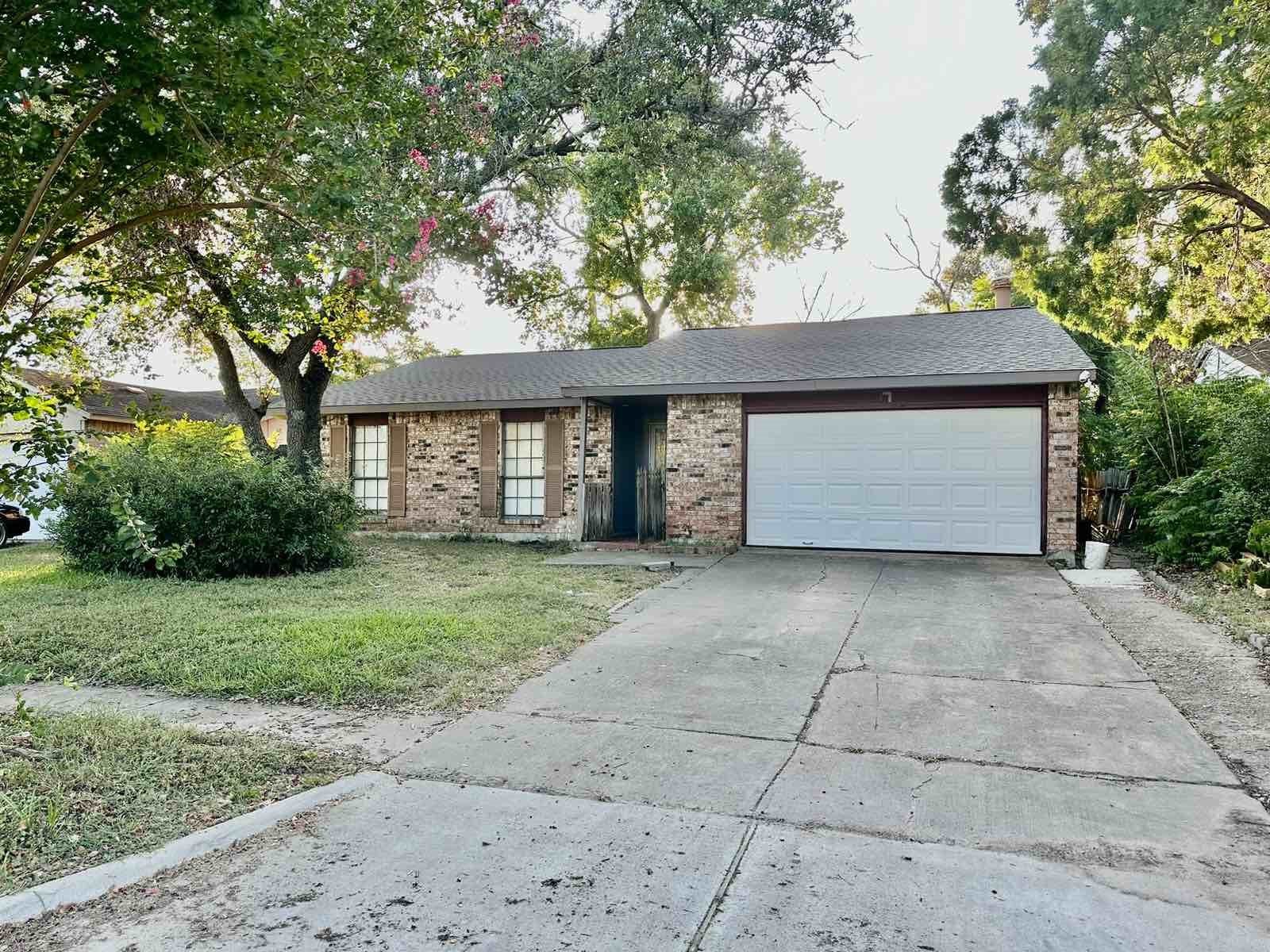16118 Lazy Ridge Road Houston, TX 77053 - Photo 2 of 23 a front view of a house with a yard and garage