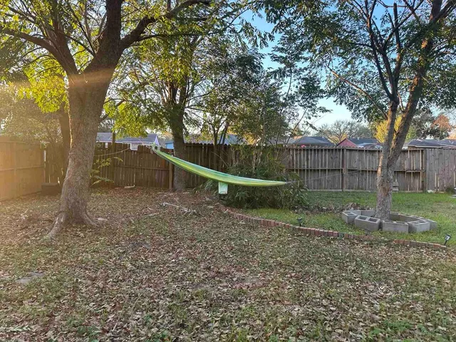 a backyard of a house with lots of green space