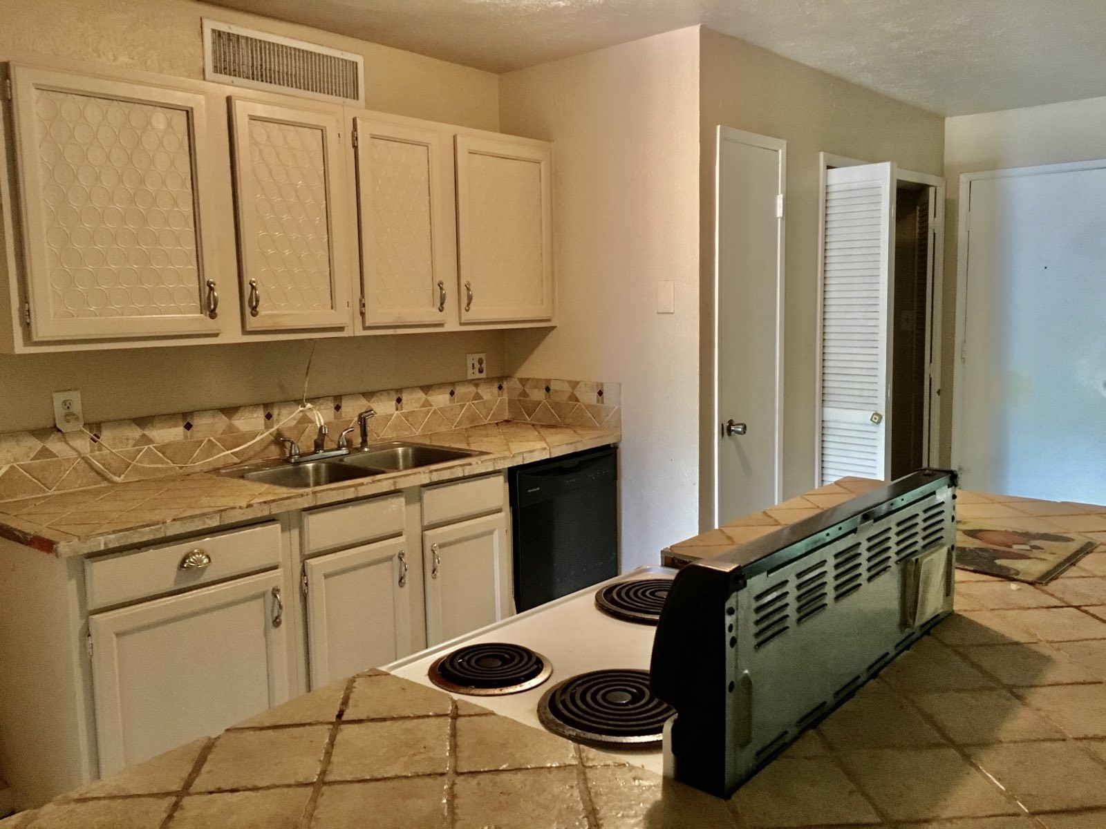 16118 Lazy Ridge Road Houston, TX 77053 - Photo 7 of 23 a kitchen with a sink and cabinets